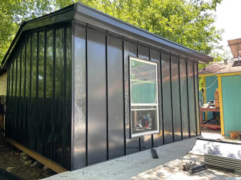 Black standing seam metal wall panels for Metal Roof Installation in New Boston